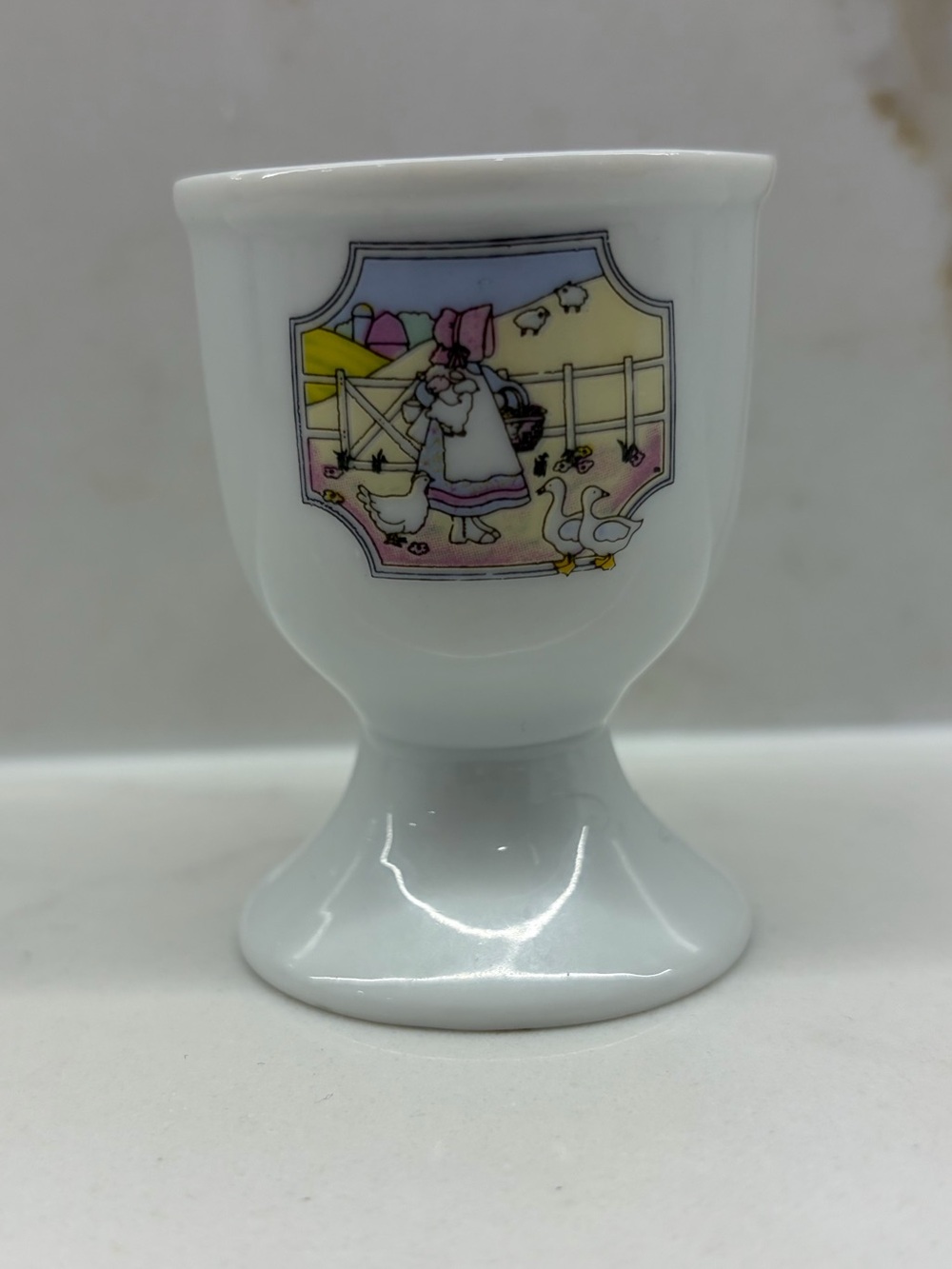 Vintage White Ceramic Footed Egg Cup with Pastel Farm Girl Geese Chicken Sheep